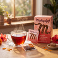 Mighty Leaf Organic African Nectar: carton, foil sachet and hand-stitched tea pouch with a cup of tea, best before Mar 26, 2027